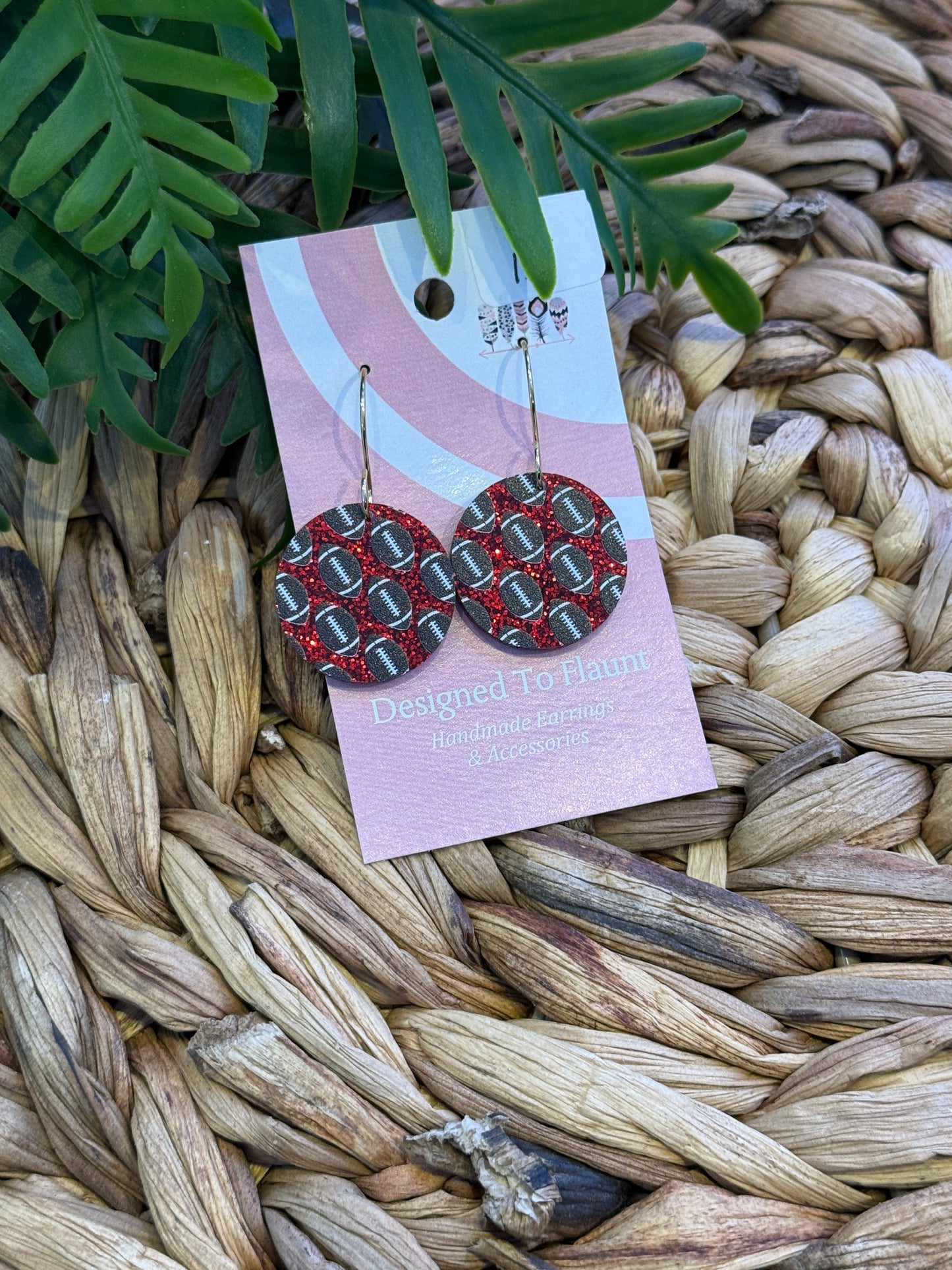 Football Scattered Print Dangle Earrings on Red Glitter