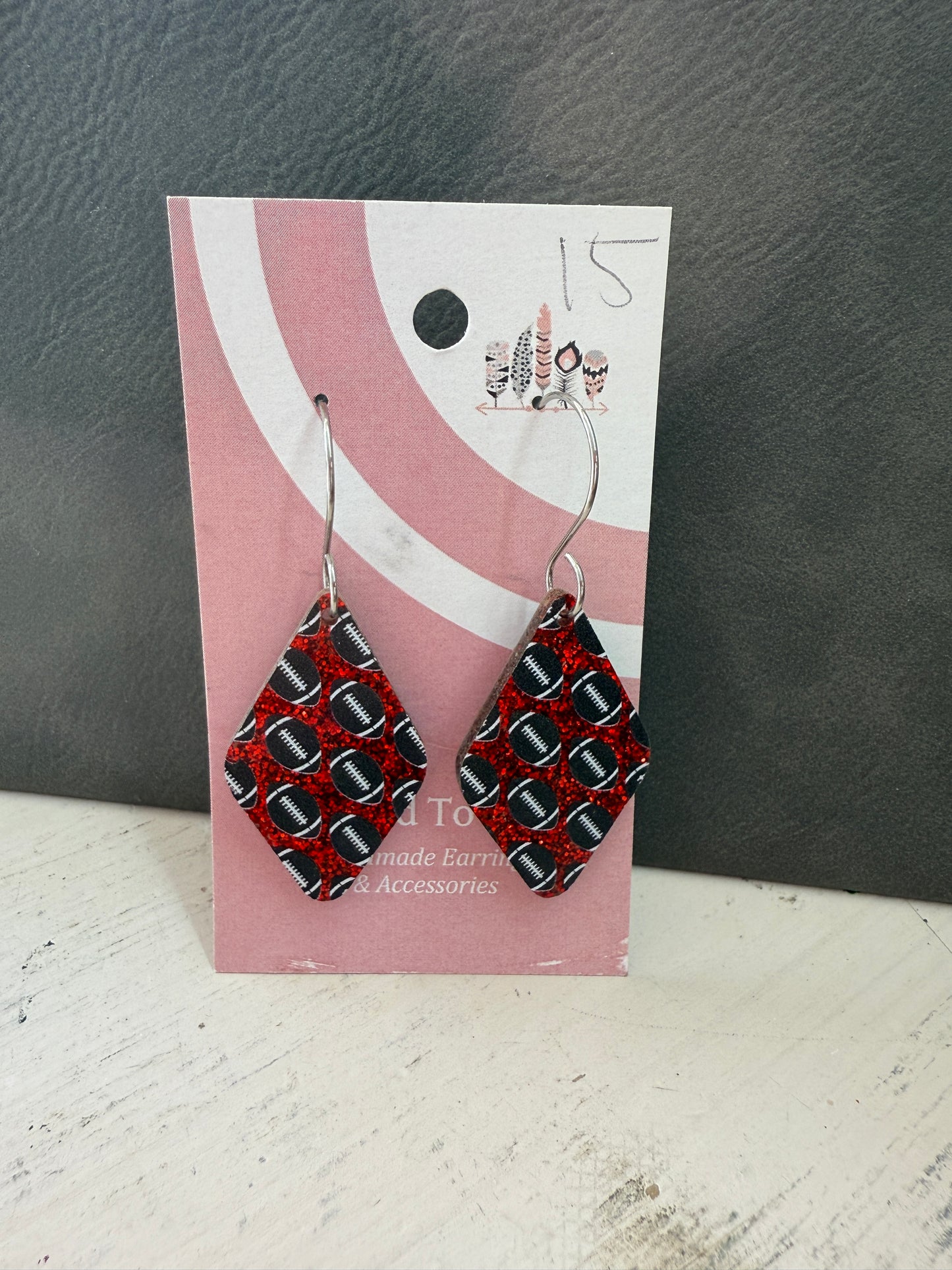 Football Scattered Print Dangle Earrings on Red Glitter