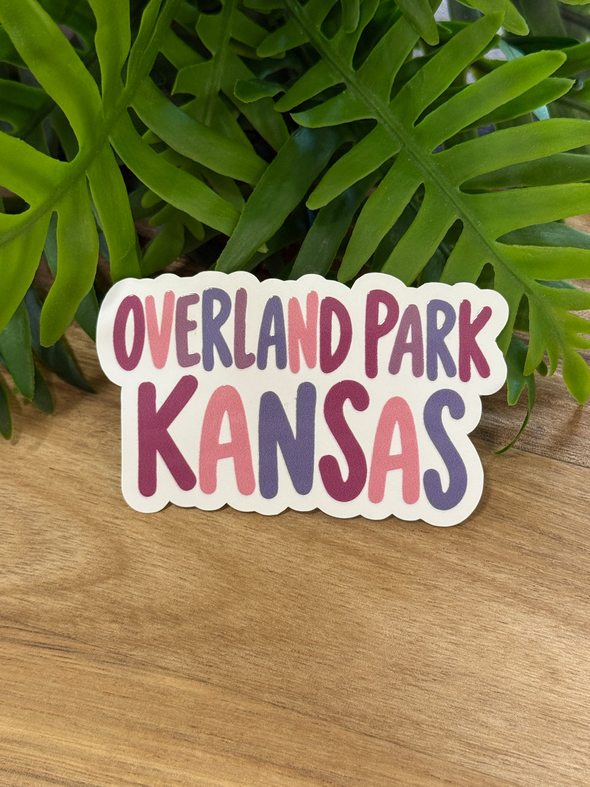 Overland Park Kansas sticker with pink, burgundy, and purple lettering and a white border