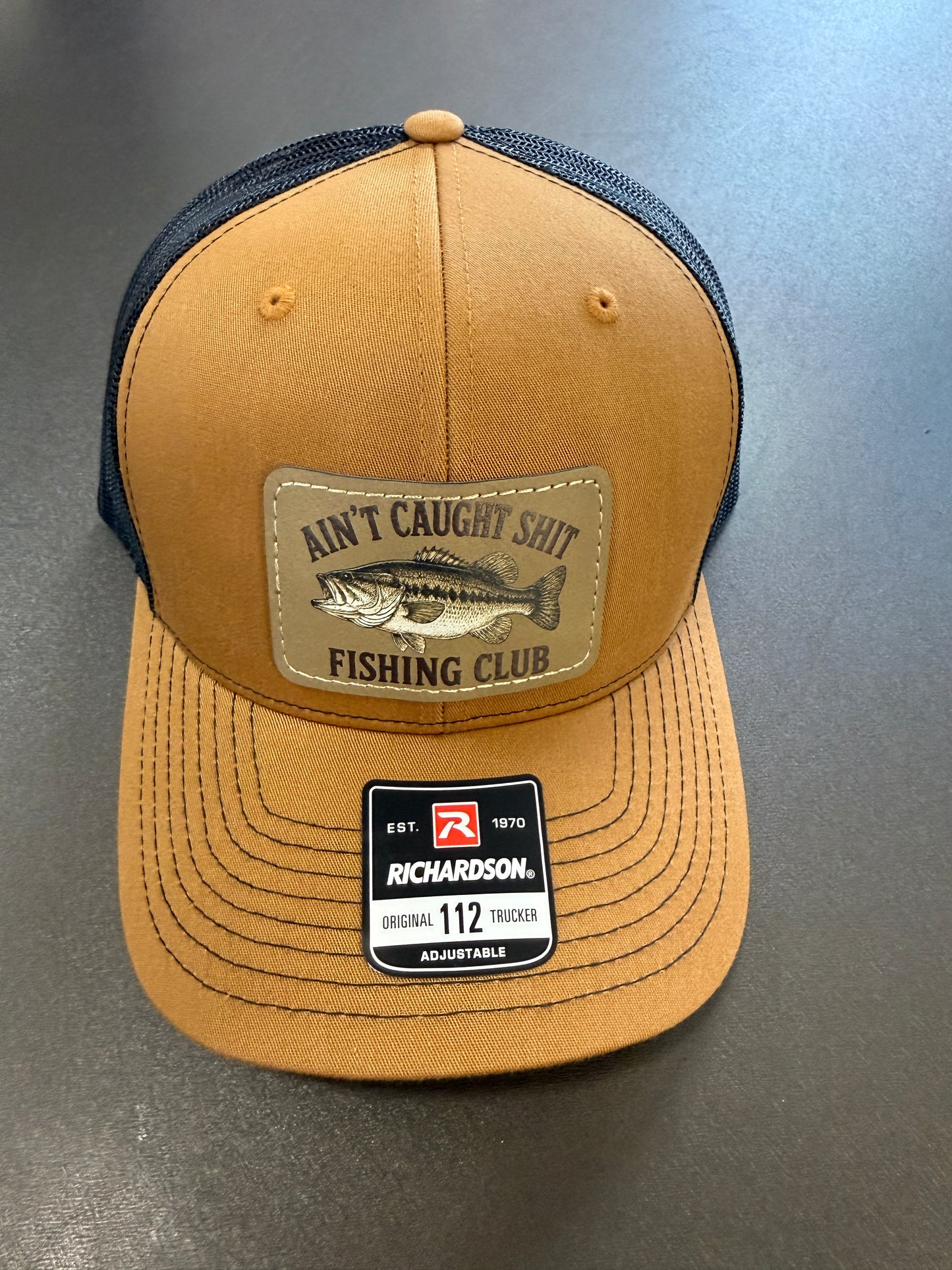 UV Printed Ain't Caught Shit Fishing Club Richardson 112 Men's Hat