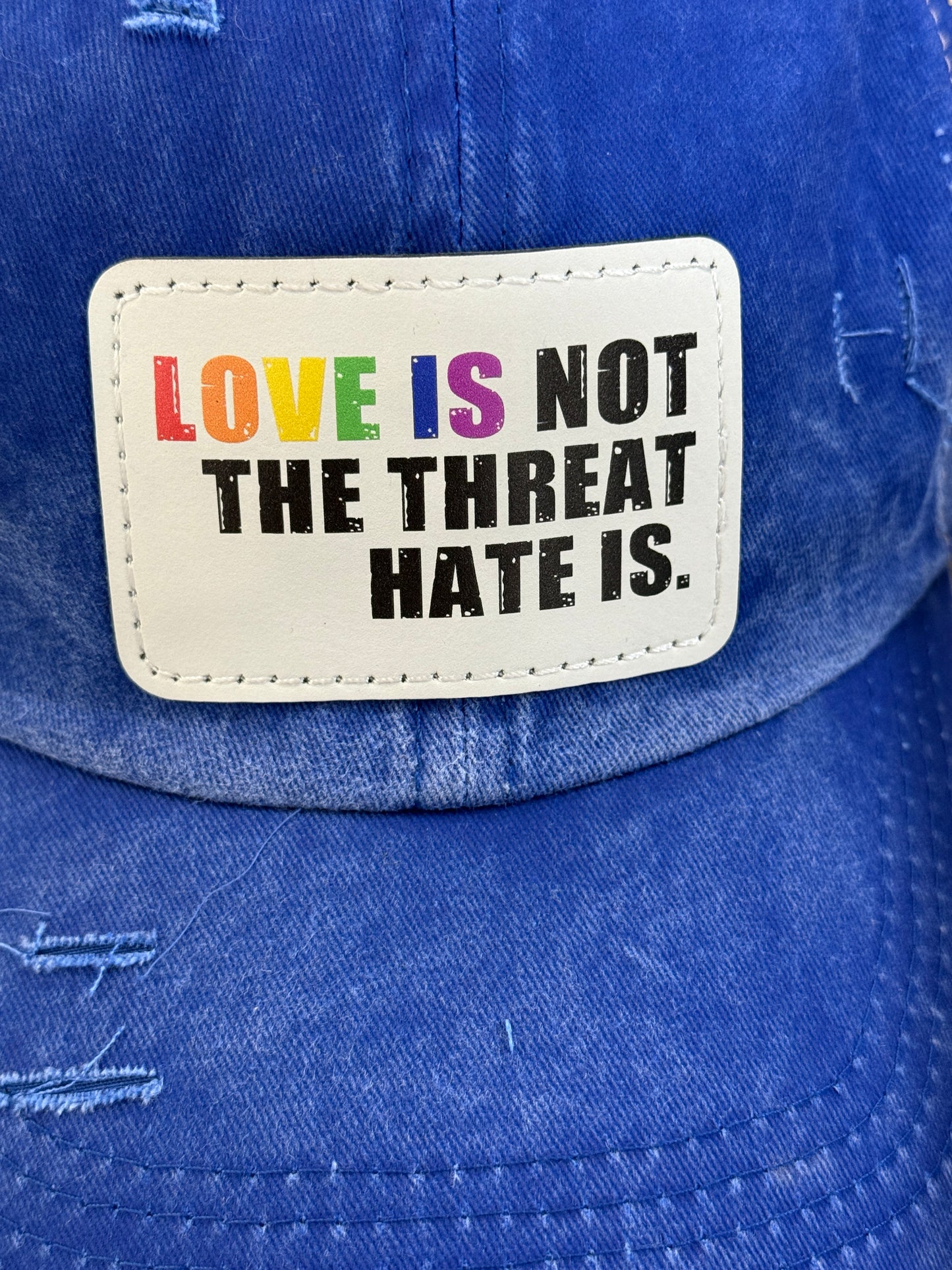 Love Is Not The Threat Pride Women's Ponytail Hat